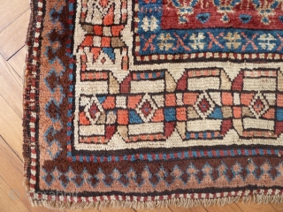 A Moghan Kurdish rug, c. 1900, with excellent long wool and lively boteh design. 271 x 110 cm               