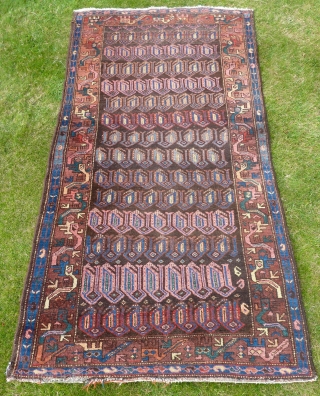 A quirky Northwest Persian Kurdish rug, early 20th Century. 198x107cm, in good pile throughout.                   