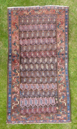 A quirky Northwest Persian Kurdish rug, early 20th Century. 198x107cm, in good pile throughout.                   