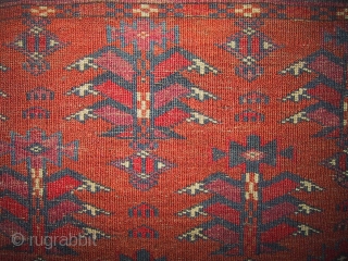 An extremely fine mid-19th century Tekke juval with glowing insect reds and silk highlights. Cloth-like handle and in original condition, save for a stitched cut to the lower left side.   