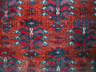 An extremely fine mid-19th century Tekke juval with glowing insect reds and silk highlights. Cloth-like handle and in original condition, save for a stitched cut to the lower left side.   