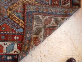 An early Shulaver or South Caucasian rug 260 x 99 cm, with wonderful bright, clear colours. Mixed wool and cotton wefts. Quite a lot of wear as you can see, but still  ...