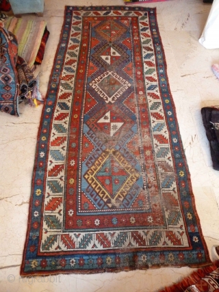 An early Shulaver or South Caucasian rug 260 x 99 cm, with wonderful bright, clear colours. Mixed wool and cotton wefts. Quite a lot of wear as you can see, but still  ...