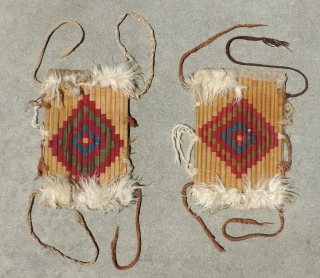 Pair Of Incan Warrior's Shin Protectors. Rare and unusual shin guards made with reeds wrapped by camelid fiber yarns in a stepped diamond pattern and trimmed top and bottom with applied alpaca  ...