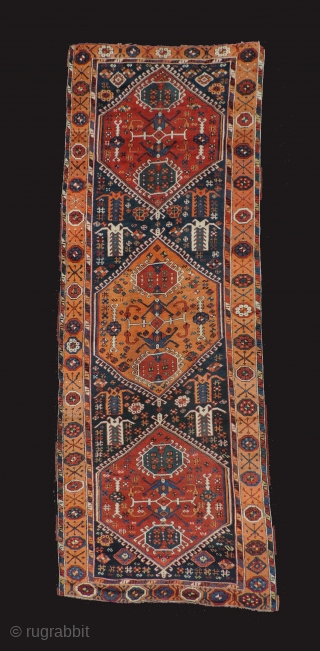 East Anatolian rug with medallions. 1st half of the 19th century or before. Three serrated medallions on a blue field. Missing minor border at top and bottom. Original selvedges.  Beautiful even  ...