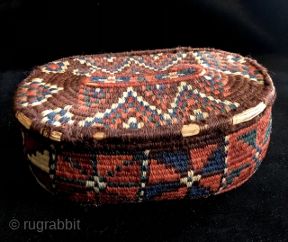  South Persian wool wrapped basket.  19th century. Very good example with all natural dyes.  Size: 10 x 6.5 x 4 inches.  Contents not included.     