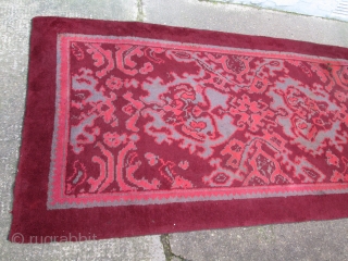 British rug, maroon ground with skeletal design in maroon, maroon-rose and grey; interesting 'neutral' colour palette which is very evocative of the rug's early 20th.century period, (slight 'fleecy' side-to-side band at far  ...