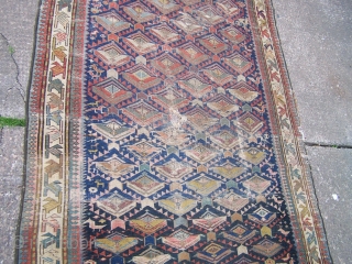 Shirvan runner, indigo field with flowerhead lattice and numerous figurative and animal motifs, diagonal leaf main border flanked by reciprocal 'dog-tooth' guards, c1900, contains synthetic colours but nice 'old style' weave, 290  ...