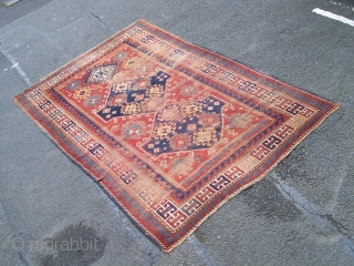 Kazak rug, Caucasian- beautiful old triple medallion rug with red field and guards giving a classic 'floating effect' with the delicate balance between motifs and red ground; this effect is compounded by  ...