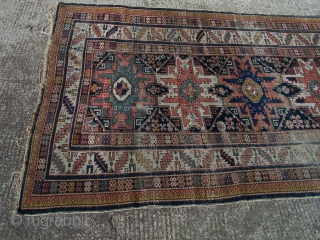 Shirvan rug, with column of four 'Lesghi' stars enclosed by ivory leaf-and-calyx border, cotton wefts, wool warps, very occasional synthetic orange (2 locations only approx -see detail image) in border, colours appear  ...