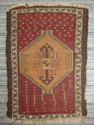 Anatolian yastik with amber hexagon spaceship medallion soaring over star-studded crimson field.  51 x 74 cm. -- Late 19th century.            