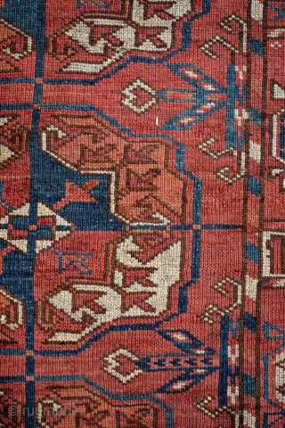 Early Tekke Main Carpet. with areas of wear, holes and a cut. 294cm x 206cm                  