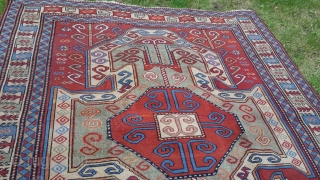 Old perez shield kazak design rug. Some areas of low pile and slight wear. Sides over woolled. Very attractive rug. 7ft 2' x 5 ft 8' (220cm x 123cm). £1500 o.n.o. plus  ...