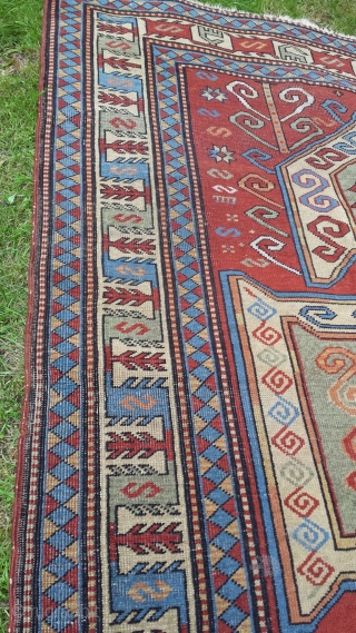 Old perez shield kazak design rug. Some areas of low pile and slight wear. Sides over woolled. Very attractive rug. 7ft 2' x 5 ft 8' (220cm x 123cm). £1500 o.n.o. plus  ...