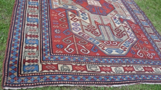 Old perez shield kazak design rug. Some areas of low pile and slight wear. Sides over woolled. Very attractive rug. 7ft 2' x 5 ft 8' (220cm x 123cm). £1500 o.n.o. plus  ...