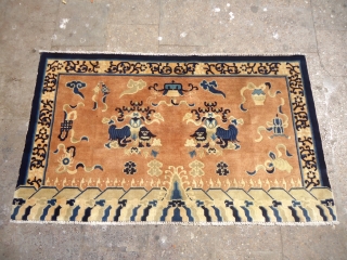 Tibet or Chinese seating rug with two dragons in the middle and beautiful design,fine weave,all good colors and fine weave.Good age,Size 5*3ft.E.mail for more info and pics.      