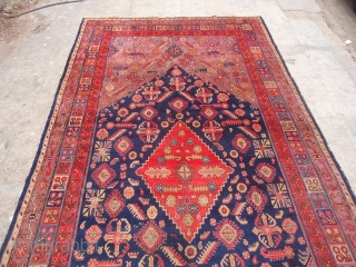 Khotan Rug with beautiful colors and desigen,very good condition without any repairs,Rare large size,very nice desigen,good age.Size 13'4"*6'10".E.mail for more info and pics.          