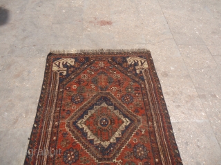 Qashqai or Shiraz Rug with four Lions each or every corner,all original without any repair or work done.Beautiful rug but worn.All natural colors.Size 4'5"*3'1".E.mail for more info and pics.    
