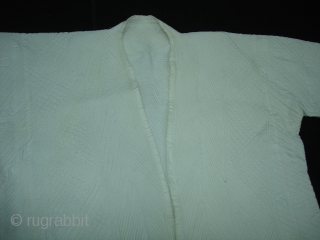 White Vohra Costume(Cotton)from Gujarat India.Made for who offer’s Namaz in mosque.Every Part is quilted inside with Portly thread. Its size,Arm is 70cm,Height is 115cm,Skirt is 135cm. Its very rare piece to find.  ...