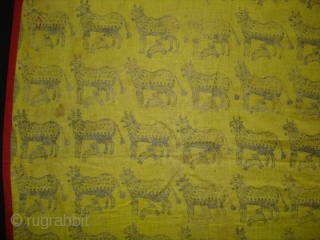 Pichwai for the Gopashtami From Gujarat India.Silver-tinsel Stamped with gum on yellow muslin cotton.Circa 1900.Its size is 82cmX100cm(DSC01463).               