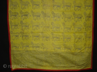 Pichwai for the Gopashtami From Gujarat India.Silver-tinsel Stamped with gum on yellow muslin cotton.Circa 1900.Its size is 82cmX100cm(DSC01463).               