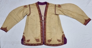 A Kashmir Embroidery Jacket-Waist Coat, Borders with Keri butis, From Kashmir, India. India. 

The front and similar motifs on the sleeves, The back and Shoulders are Decorated with Elaborate Keri Butas..

C.1875 -1900.  ...