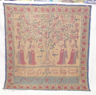 An Roller Print Pichwai depicting the Lord in the form of a tree with abundance and life. It's flanked by Gopis on both sides venerating the divine and the lower register shows  ...