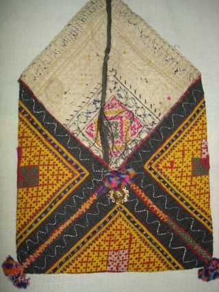 Dowry Bag(Bhujki),Mahar group,From Jaisalmer District of Rajasthan.India.Cotton embroidered with silk and cotton,mirrors,cotton tassels and string.H.30cm,W.20cm(DSC05959 New).                 