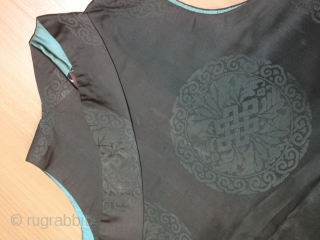 A female Tibetan Chuba (Female Robe), made from Chinese damask brocade silk in subtle gray color. Brocade motif is roundles of interlaced Ruyi, foliage  with endless knot in the center.Inside lined  ...