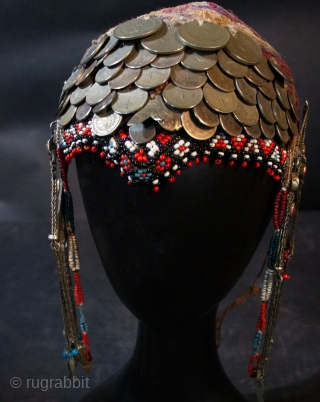  Original, rare embroidered headdress, with beading, silver coins and ear pendants. Kurdish , Khorasan , Northeastern Iran, Southern Turkestan.  Note similarity to Turkman style ear pendants. Early 20th c  