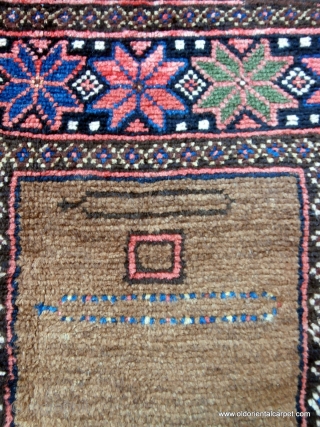 RARE AFGHAN PRAYER RUG. The contents of the field make this an extraordinary and rare piece. At the top there are depictions of two pendants known as "tumar". These are sometimes attached  ...