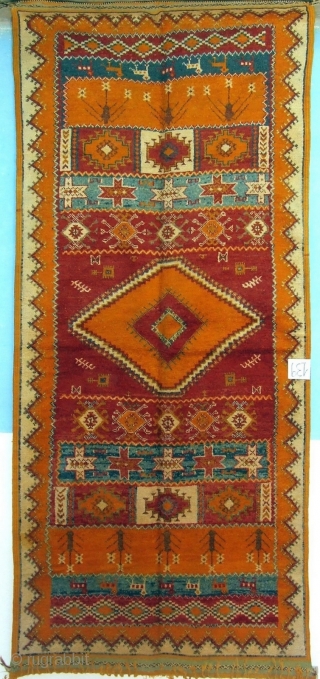 MOROCCAN HIGH ATLAS BERBER CARPET, an old and rare piece in excellent condition which is from the Ait Tamassine Berber group. The weaver has included in her random designs depictions of traditional  ...