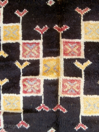 MOROCCAN BERBER HIGH ATLAS CARPET from the Ait Zenaga Berber tribe. Although the deep field color is typical of Ait Zenaga weaving the rest of the colors and design are most unusual  ...