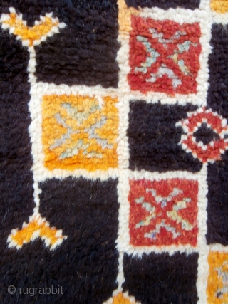 MOROCCAN BERBER HIGH ATLAS CARPET from the Ait Zenaga Berber tribe. Although the deep field color is typical of Ait Zenaga weaving the rest of the colors and design are most unusual  ...