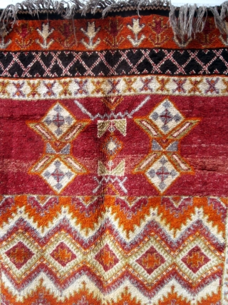 MOROCCAN BERBER HIGH ATLAS CARPET. The high knot density and lustrous shades of the many colors used makes this old example special. Many Ait Tamassine Berber pieces have this overall effect of  ...