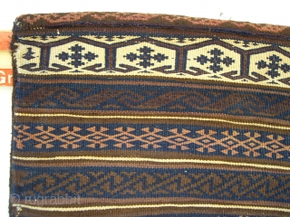 RARE ANTIQUE BELOUCH SADDLEBAGS. A collectors item. These finely woven bags are ebroidered on the reverse with rows of goats and peacocks. The bags are in excellent condition and complete with the  ...