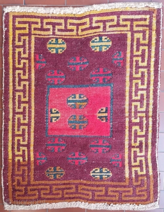 Excellent, genuine old Tibetan rug with simple and archaic multicolor shou in a large yellow frame, mat size (circa 73 by 59 cm at widest points), nice abrash (more faithful colours can  ...