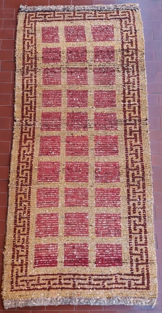 Absolutely unusual and rare Tibetan rug, khaden size (178 by 80 cm), genuine, old, complete, perfect condition, no repairs; it looks like a Wangden rug with its typical wool, knotting, structure and  ...