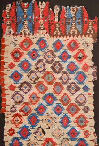 Early example!A fragment of a two-panel kilim from the surroundings of Central Anatolian Sivas, 18th Century Kilim Fragment. It has perfect colors and archaic ends. Size 135 x 230 cm It has  ...