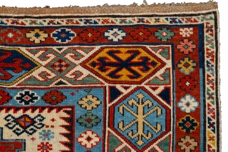 Caucasian Kuba Rug The white field contains three Lesghi stars, alternately in shades of blue and red, which are surrounded by a multitude of small hooked diamonds, stars, crosses and blossoms. The  ...