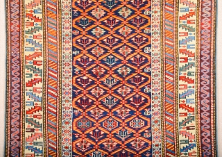 A blue-ground Kuba displaying a lattice design of yellow serrated leaves enclosing flowering shrubs. Mid 19th Century Shirvan Kuba Rug It has a nice pile on it. Lovely colors Size 110 x  ...