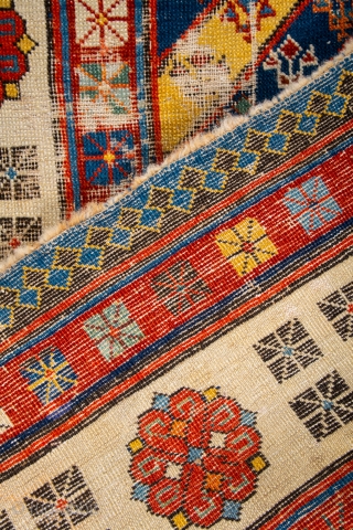 Middle of 19th Century South East Caucasian example, with an yellow and blue field and large rosettes in the white-ground main border, serves as a particularly good illustration of the design affinity  ...