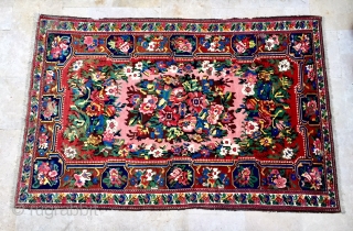 Description and origin: Description and origin: a "Gol Farang" Bakhtiyar-style woven rug with central panel of floral motifs and dense floral border.  rug from the Chahar Mahal region inspired by textiles  ...