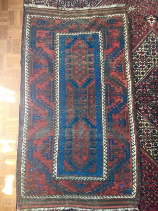 Electric blue Baluch with graphic large scale design. 58" X 33." Sides are 100% good! Wear. Inexpensive.                