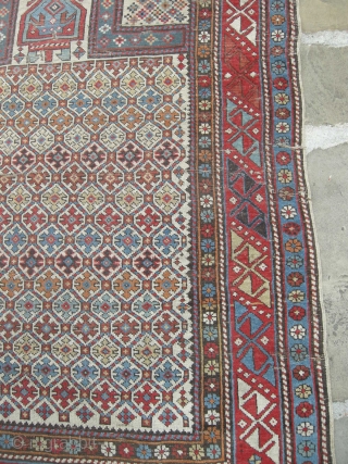 A good 19th century shirvan prayer rug in original condition needs a clean light wear and a few small holes but with ends and sides mostly in tact.     