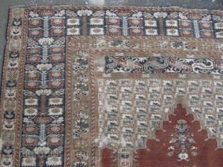 An Antique Giordes rug late 19th century , backed and ready to hang. Approx 4ft8 x 3ft8,                