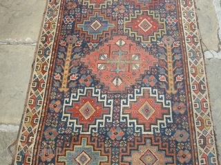 a very beautiful mid or early 19th century nw persian ?kurdish runner. Approx 15ft x 3ft. I think it's missing an outer guard there are condition issues. Low parts two very old  ...