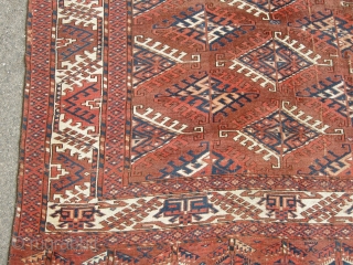 An unusual Antique Turkoman main carpet. Size 11ft 4 x 6ft9. Unusual border design. Not in the best condition wear to one end sides not original.A very attractive carpet.    