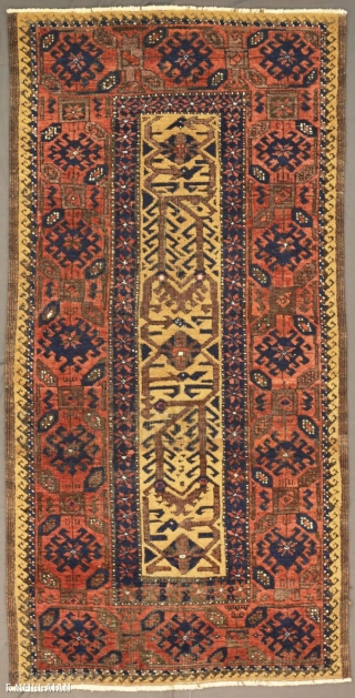 Beautiful Antique Persian Baluch Mashad Rug, 1880-1900
120 × 70 cm (3' 11" × 2' 3")

The light beige field with overall design of angular Hooke vine and lozenge palmettes. In broad light red  ...