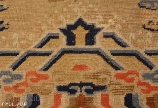 This is an antique Ningxia carpet from China and it was woven during the 18th century. It has a central foo dog and many more throughout the rest of the rug. It  ...